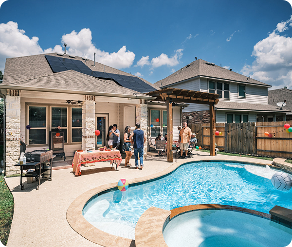 Backyard pool party with solar panels.